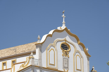 facade detail with a stork nest of the United Pentecostal Church in Portimão, algarve, - obrazy, fototapety, plakaty