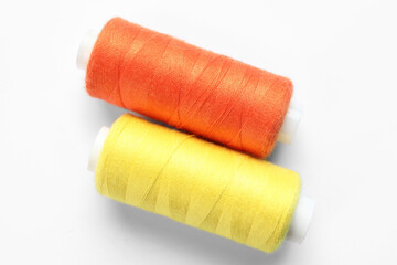 Beautiful sewing threads on white background