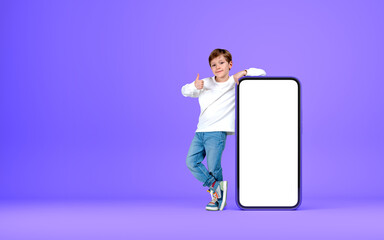 Child wearing casual wear is holding on empty mobile case