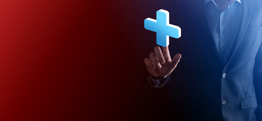 Obraz premium An empty workpiece. A businessman in a suit on a black background holds his hands protective gesture. A gesture of care and patronage.