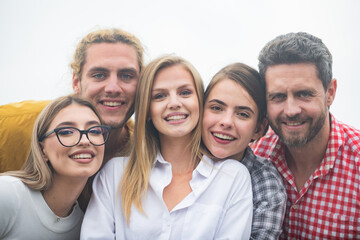 Photo of happy company students best friends making selfies. Group of happy people young friends, close up face.