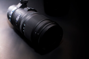 Professional zoom lens for digital cameras isolated on a black background