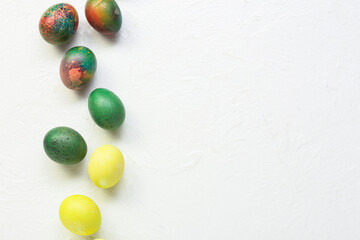 Composition with Easter eggs on light background