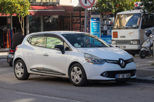 Side; Turkey &ndash; February 13 2022:  white Renault Clio  is parked  on the street on a warm summer day against the backdrop of a  street