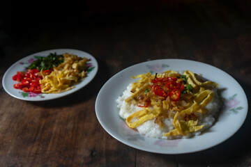 Bubur Ayam, Indonesian rice porridge served with shredded chicken delicious for breakfast food, selected focus	