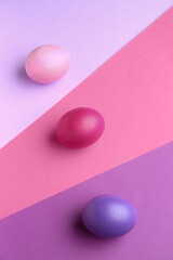 Painted eggs for Easter celebration on color background