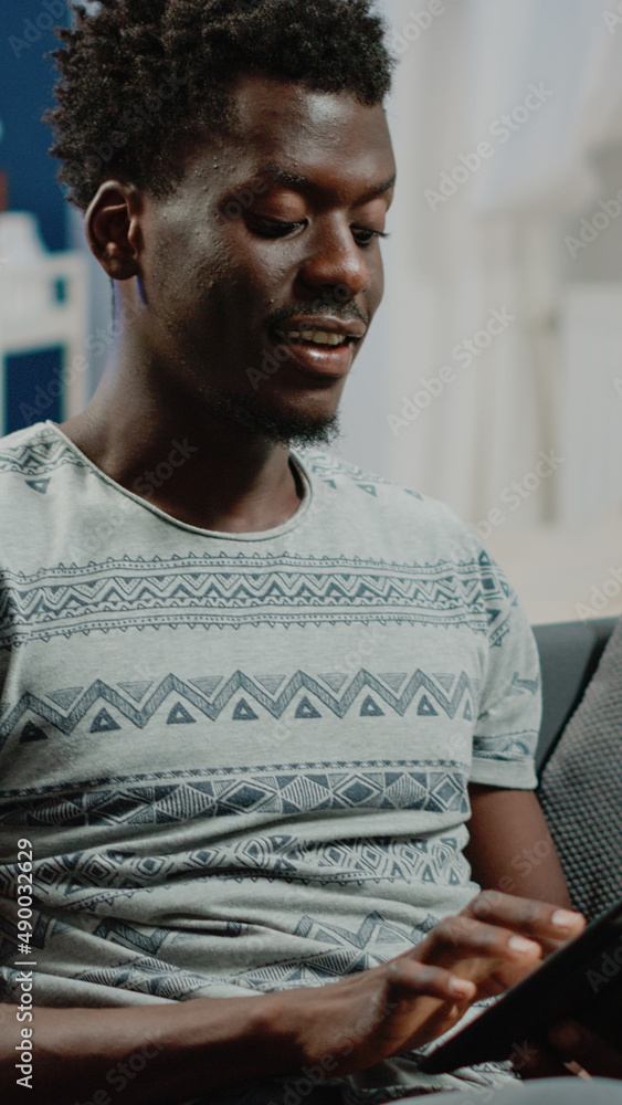 Poster close up of adult looking at digital tablet after remote work, enjoying free time activity. person u