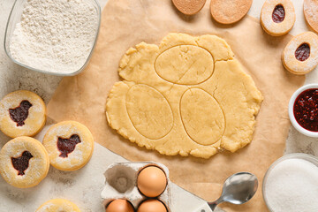 Fresh dough and ingredients for preparing cookies for Easter celebration on table