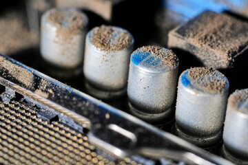 Close up macro shots of the insides of a dusty old computer motherboard showing the various components