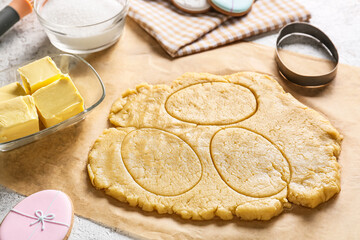 Fresh dough for preparing Easter cookies on table