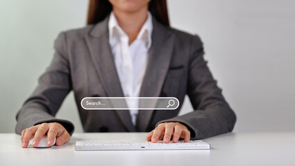 Attractive female hands using laptop computer keyboard searching, browsing internet data online information with search bar console interactive on screen. Lifestyle with technology