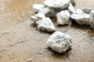 lump of silver or platinum on a stone floor