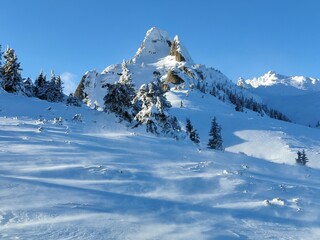 Winter in the mountains. Hiking during wintertime. Snow storm in the high mountains