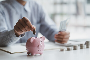 Man putting coin in piggy bank. saving money, budget, investment, finance concept