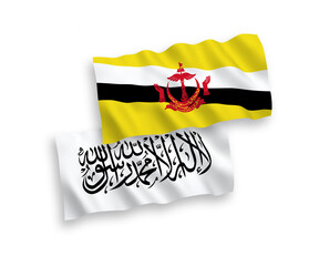 National vector fabric wave flags of Taliban and Brunei isolated on white background. 1 to 2 proportion.