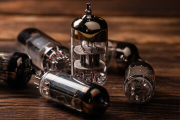 Vacuum electronic radio lamps tube on wooden background
