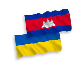 National vector fabric wave flags of Kingdom of Cambodia and Ukraine isolated on white background. 1 to 2 proportion.
