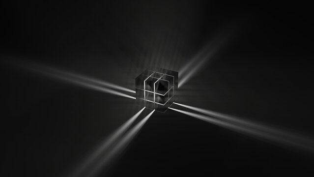 A black rubic (with light in it) on a black floor