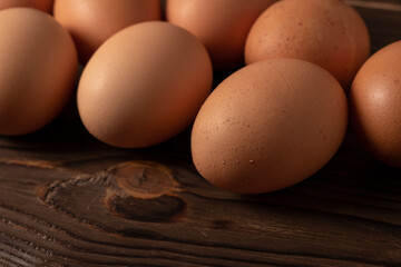 Fresh farm eggs on a wooden rustic background