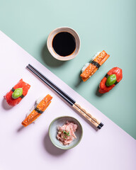 Vegan sushi flatly with soy sauce and chopsticks