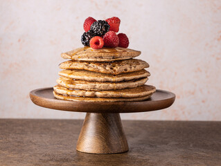stack of vegan pancakes with berries