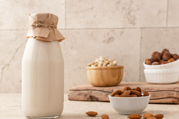 Vegetarian milk with different nuts: almonds, hazelnuts, cashews. Alternative milk. Lactose free.
