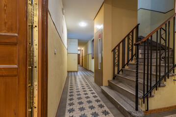 Hall and common areas with elevator and staircase with a residential vacation rental home