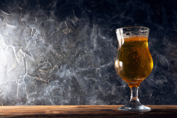 Glass of beer  in a rustic style with a place for text. Glass of beer  in a rustic style with a place for text.