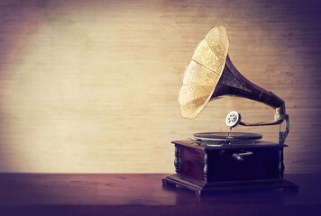 Getting lost in the music of old. Vintage style shot of a gramophone.