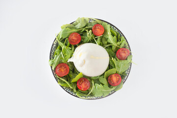 Burrata salad with burrata cheese, cherry tomatoes and rocket leafs