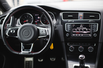 Car interior luxury steering wheel. Dashboard, climate control, display