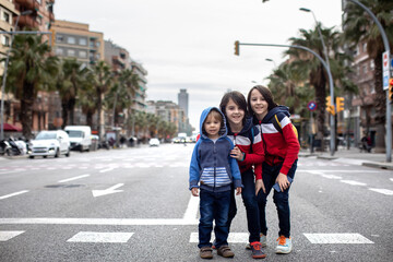 Cute little children tourists admiring Barcelona city, family travel with kids