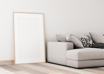 Image 3D. White wall with empty frame. Profile view. with light colored parquet. Light natural. Picture next to a gray sofa with large pillows