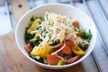 Salad with bell pepper, tomato, beansprouts, fresh parsley in a bowl, vegetarian, vegan food, diet