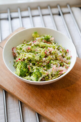 Salad with raw broccoli, raddish and fresh dill, diet, post, vegan, vegetarian