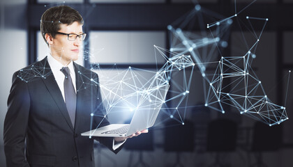 Attractive young european businessman using laptop with abstract polygonal network mesh hologram on blurry office interior background. Metaverse and AI concept.