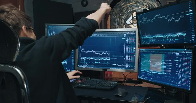 Man, freelance trader on the stock exchange, sees growth of quotations on chart and is very happy. Home environment. Concept of game on the stock exchange for trading stocks, futures and bonds
