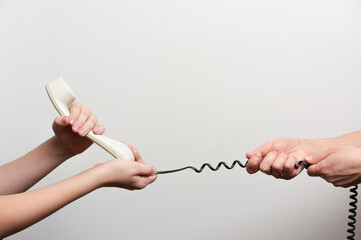 one person snatches the phone from another person