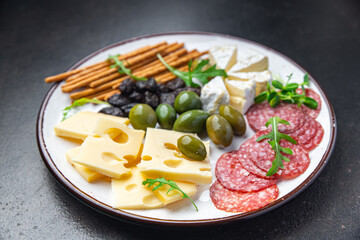 snack plate cheese, sausage, olive, bread stick fresh appetizer meal food snack on the table copy space food background