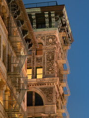 Soho building with intricate facade, terra cotta ornamentation, copper cornice and painted iron fire escape. Manhattan, New York City © Francois Roux