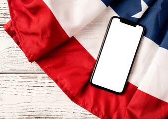 Blank screen on modern smartphone for mockup design on USA national flag