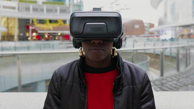 Woman with VR goggles in city, Italy