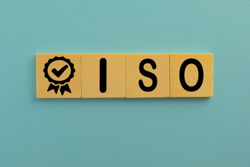 ISO quality control certification concept.,Black quality warranty icon and ISO word on wooden cube...