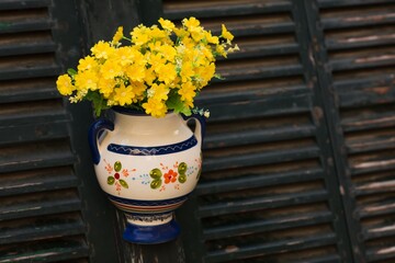 Street decoration. Ceramic flowerpots with flowers. Symbolic for a village in Mallorca, Spain.