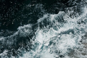 Fototapeta na wymiar Sea waves, water detail, tide at sklalisk. Sea water in Mallorca, Spain.