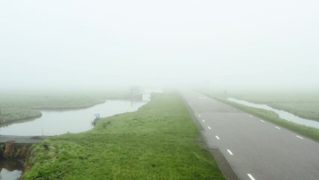 Old ditches in polder landscape in fog, Oud-Alblas, Netherlands