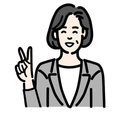 笑顔でピースサインをしているグレーのスーツを着た中年女性
