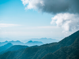 Layered mountain view of sunny day