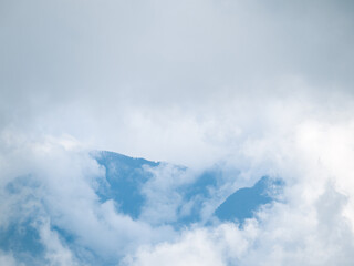 Fog and clouds are covering the forests and Layered Mountains