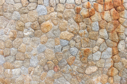 Fototapeta Stone walls are stacked together to form a wall.